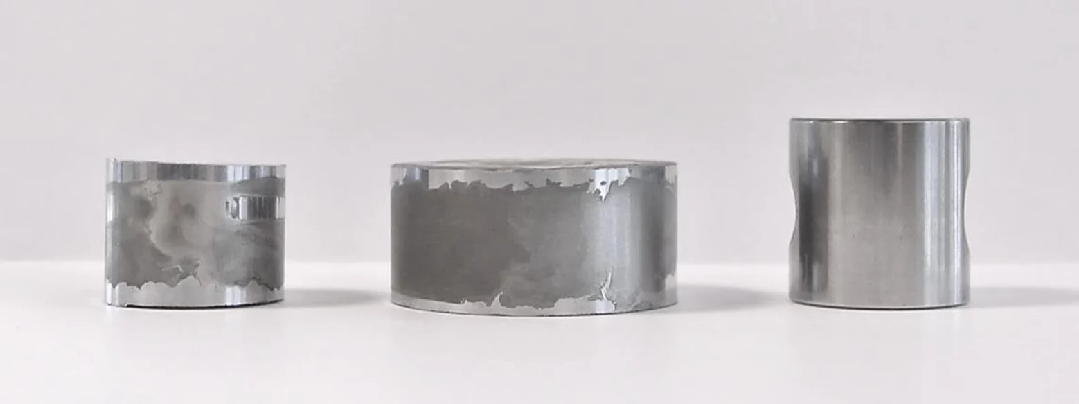 Three test pieces after 5 % sulphuric acid at 100 °C: two hard chrome pieces with corroded, pitted surfaces and a TripleHard® piece with an intact bright surface